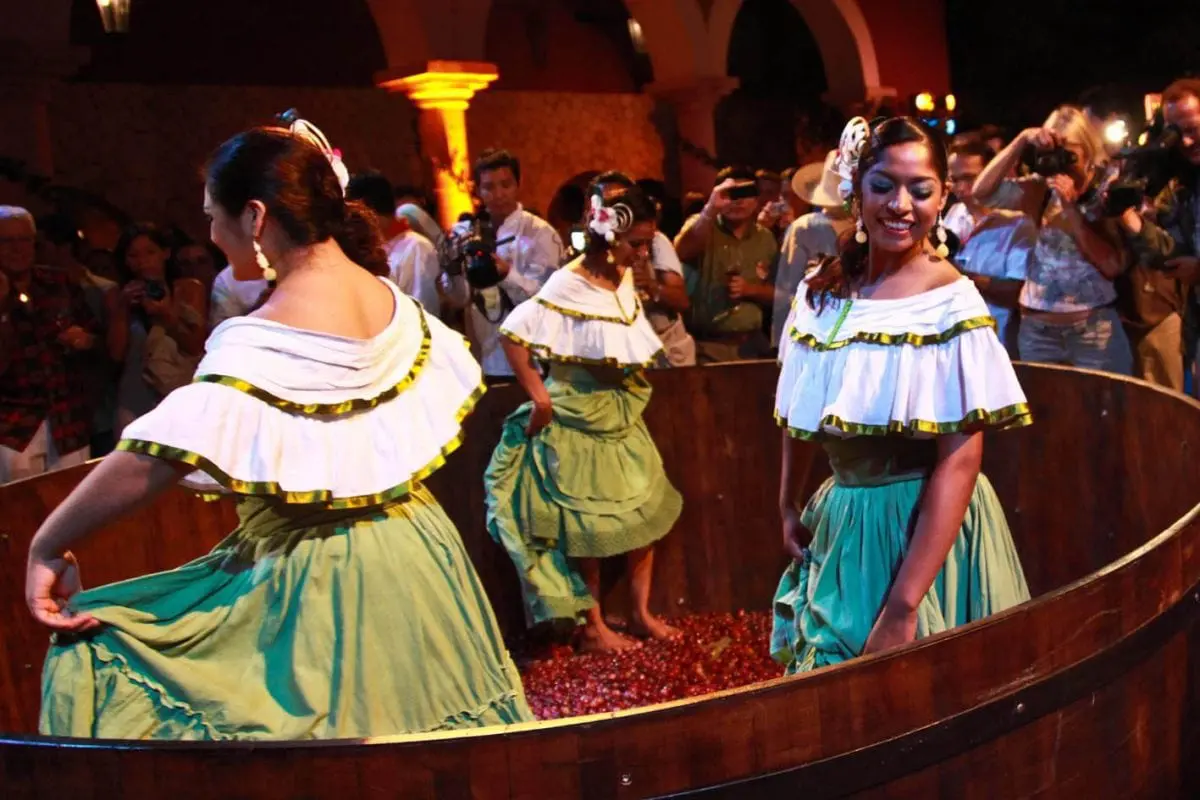 People crushing grapes with feet