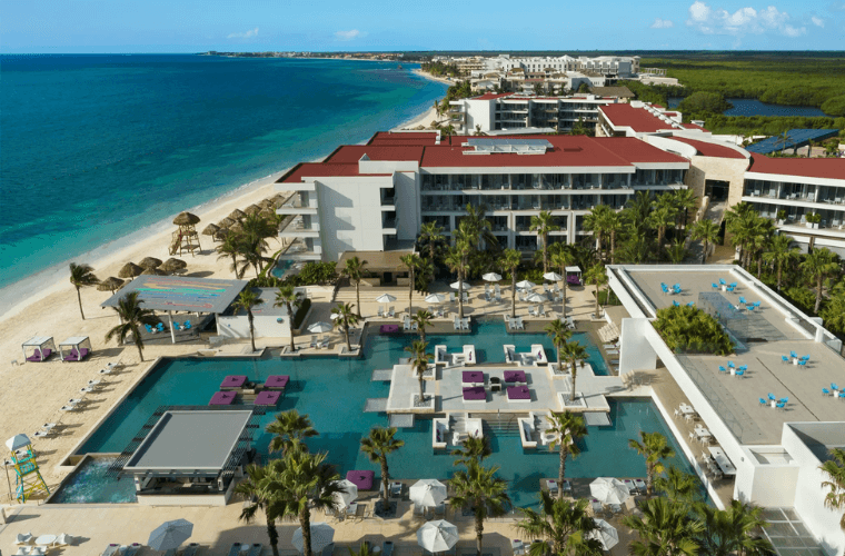 the Energy pool at Breathless Riviera Cancun with a beachside location 