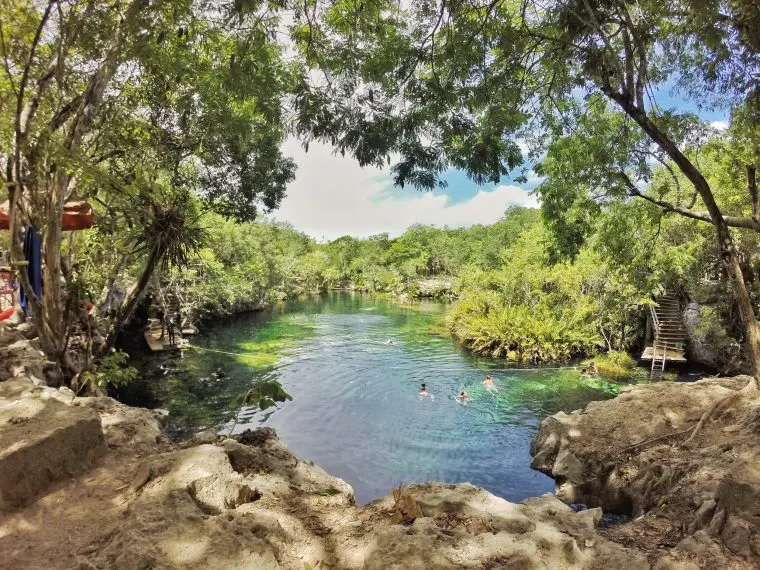 People swimming in cenote in Playa del Carmen