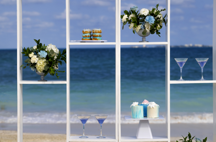 shelves decorated for a wedding at Planet Hollywood Cancun with flowers, glasses, and candles on them 