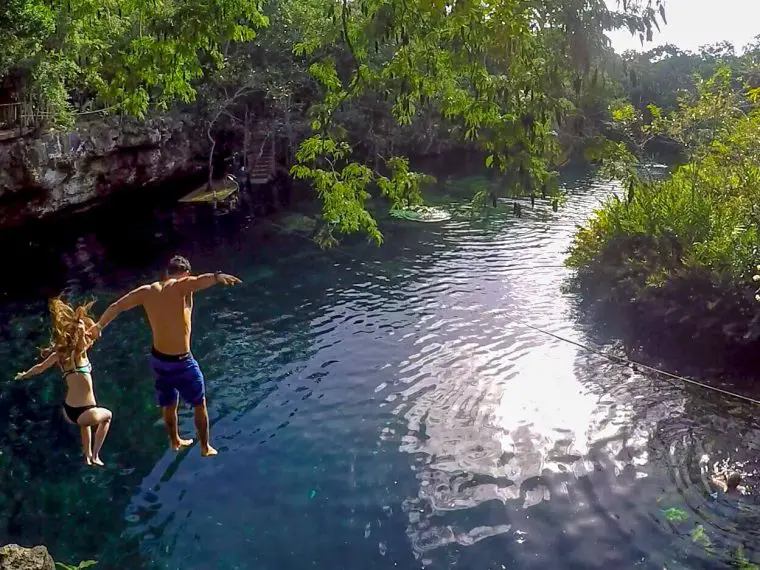 People jumping in cenote in Playa del Carmen