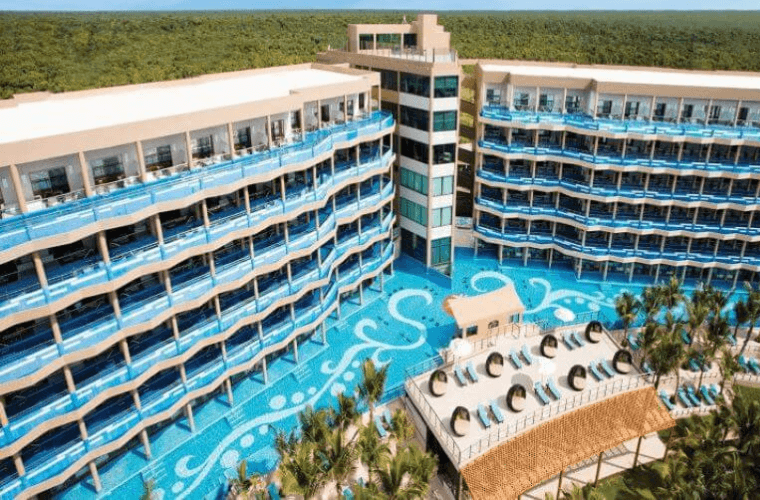 the pool area and accommodation blocks at El Dorado Seaside Palms 