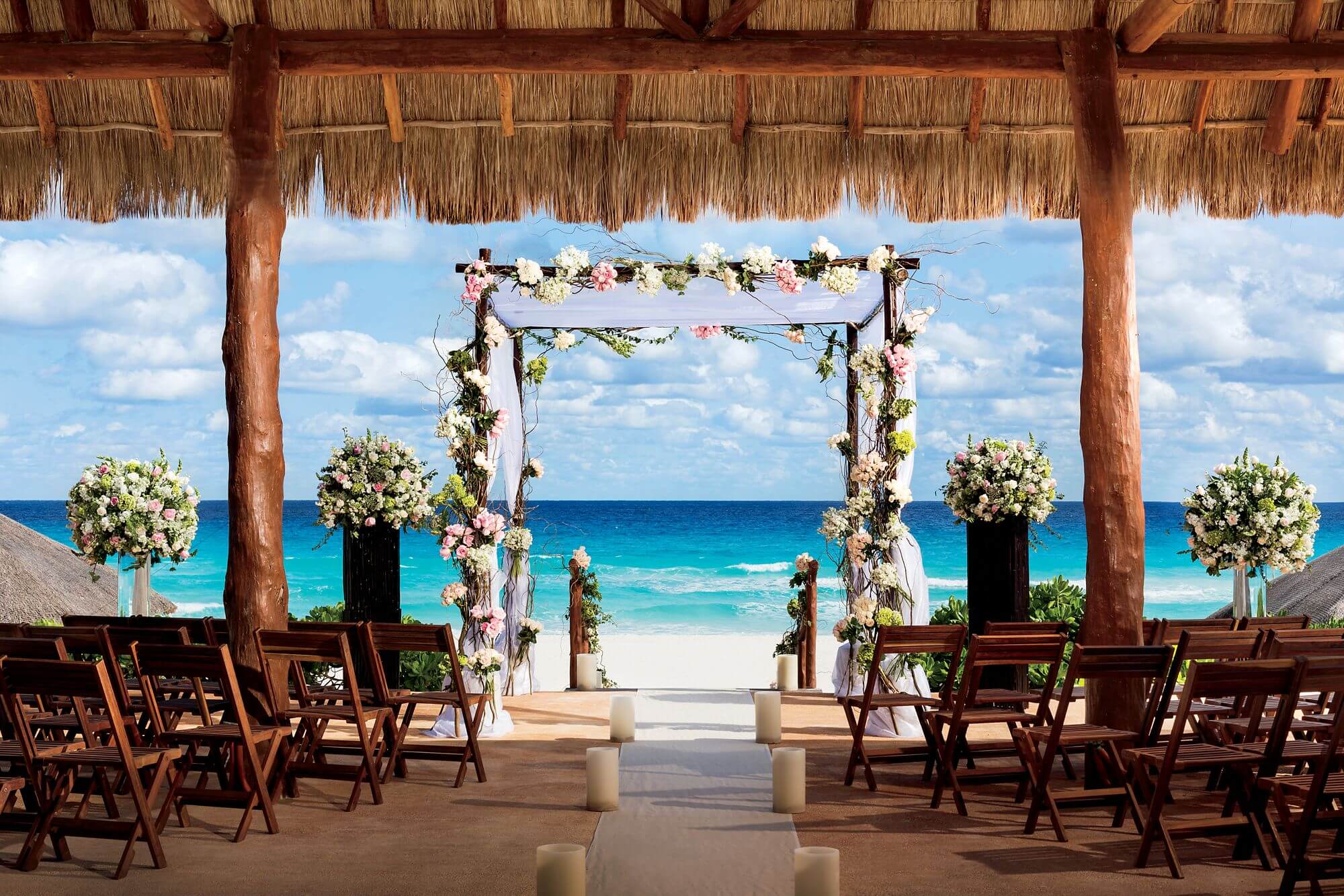 beautifully decorated beach wedding arch in Cancun