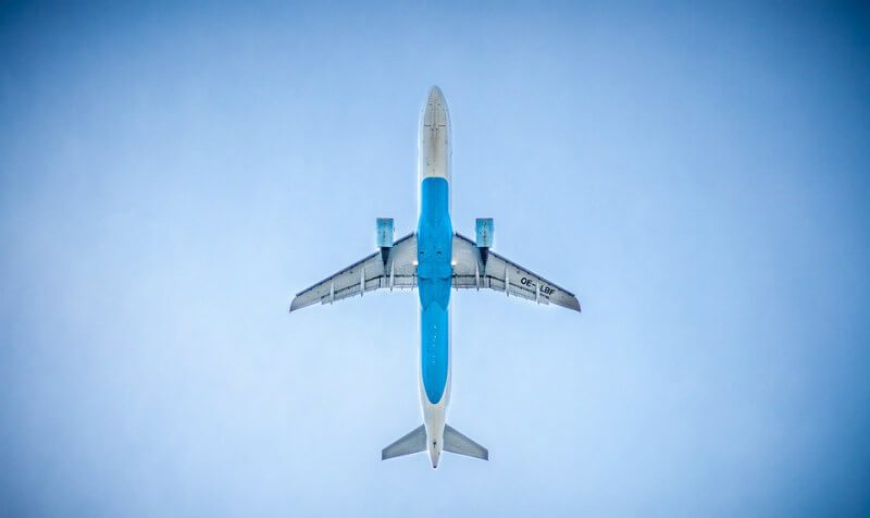 Airplane flys over Playa del Carmen