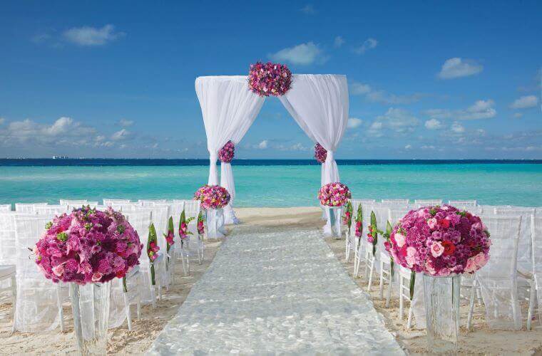 beach wedding setup at Dreams Sands Cancun 