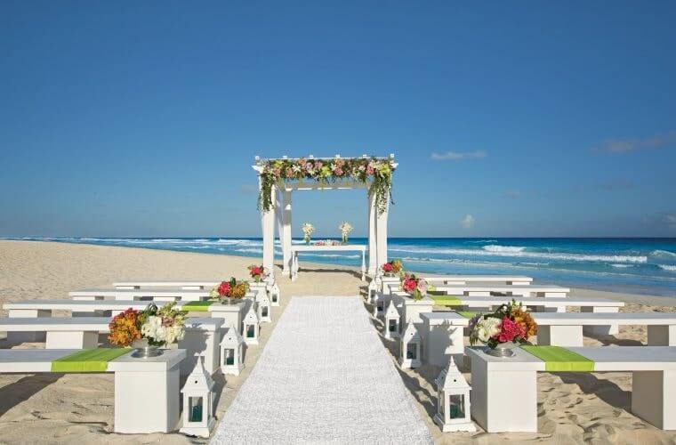 beach wedding setup at Secrets The Vine Cancun 