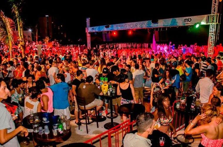 people dancing at night at Mandala Beach