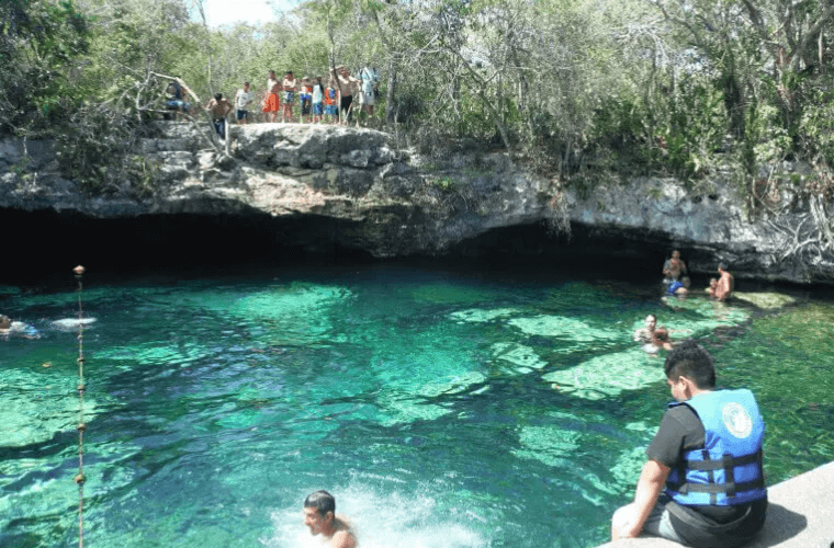 people swimming in a Mexican cenote 