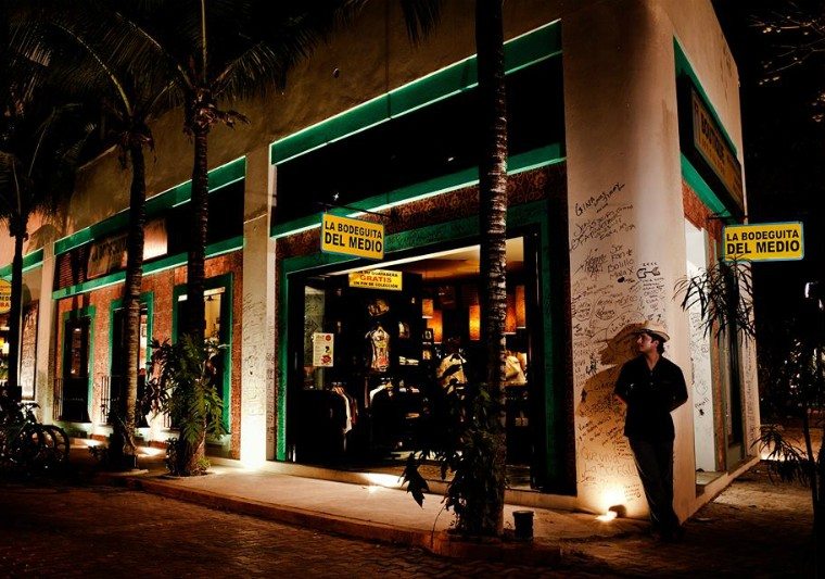 A somewhat Cuban looking man stands outside La Bodeguita del Medio in Playa del Carmen