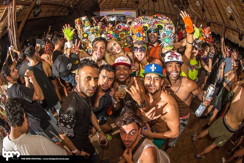 Partiers at the BPM Festival smile for the camera in Playa del Carmen