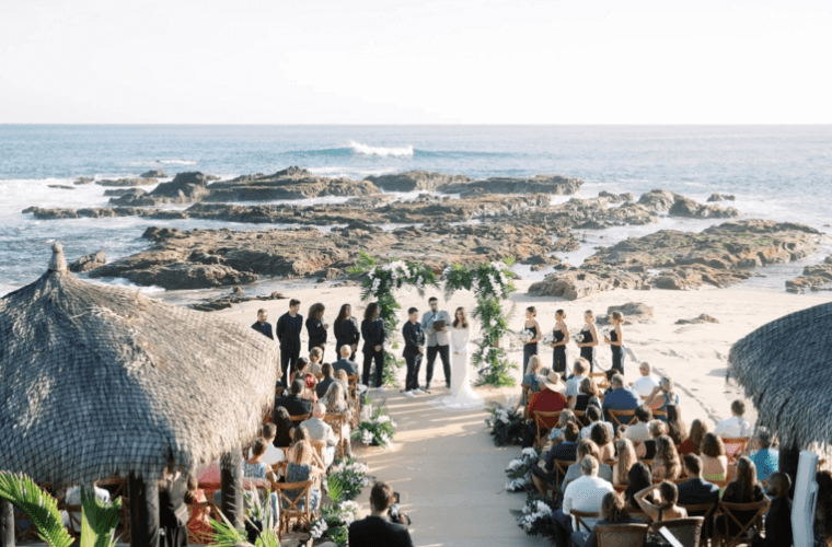 The wedding of Chloe Bridges and Adam Devine with the Pacific Ocean as a backdrop