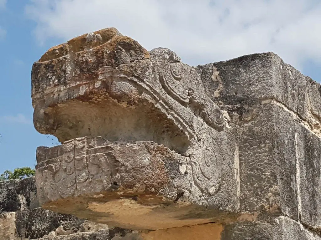 A carved serpent at Chichen Itza ruins in Mexico
