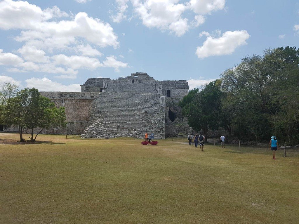 Tourists visit the ruins on a Chichen Itza tour