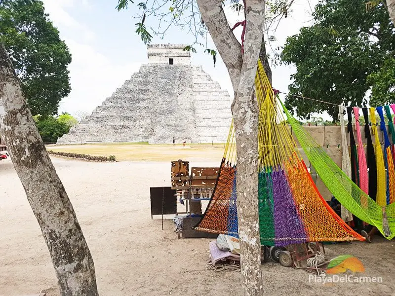 A hammock hangs in a tree in front of El Castillo or Kukulkan Pyramid in Chichen Itza