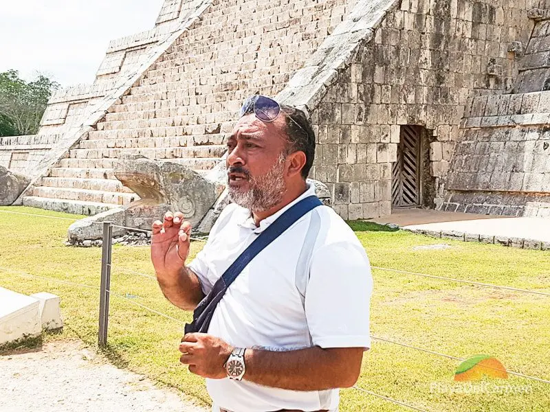 Guide at Chichen Itza standing in front of the Kukulkan Pyramid