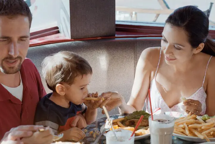 Parents feeding their child