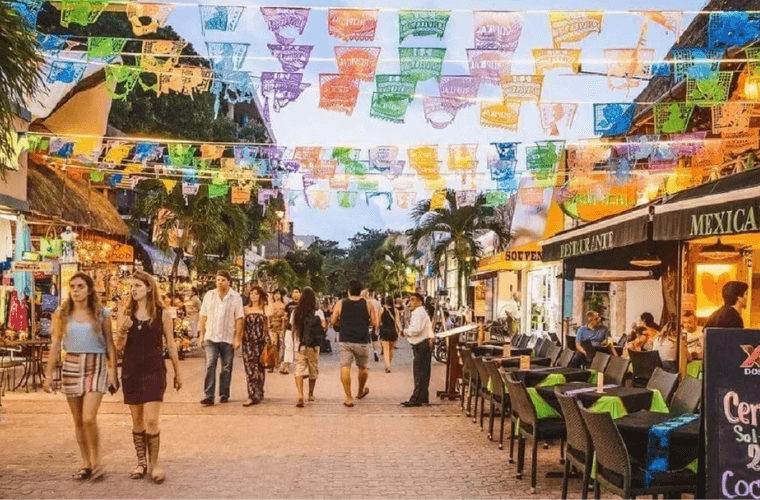 people walking along 5th Avenue in Playa Del Carmen 