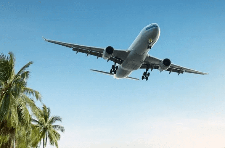 a passenger jet flying across a blue sky