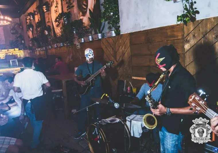 Mask wrestlers play a live set at La Drinkeria by Henry Miller in Playa del Carmen