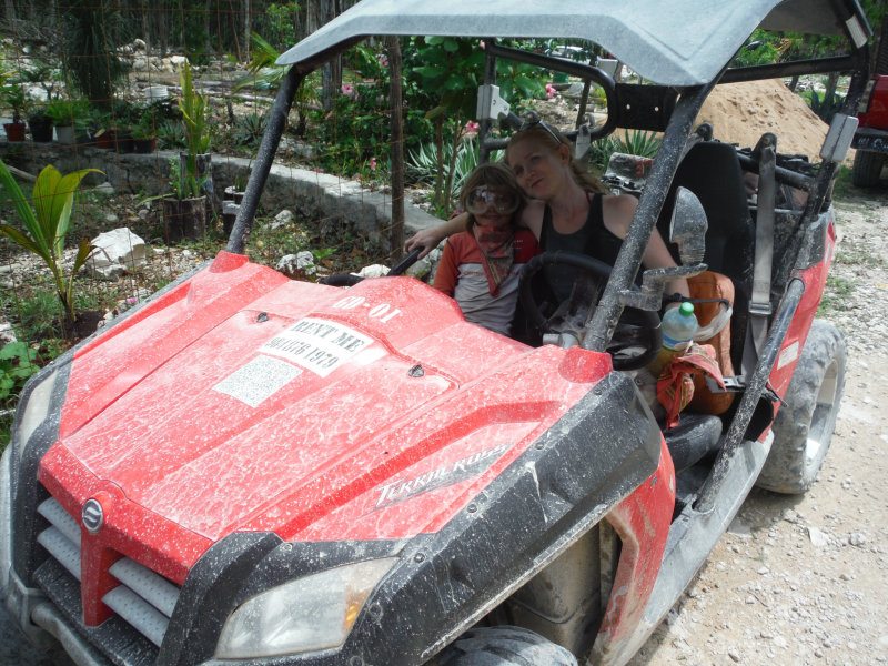 Mother and son in red dune buggy