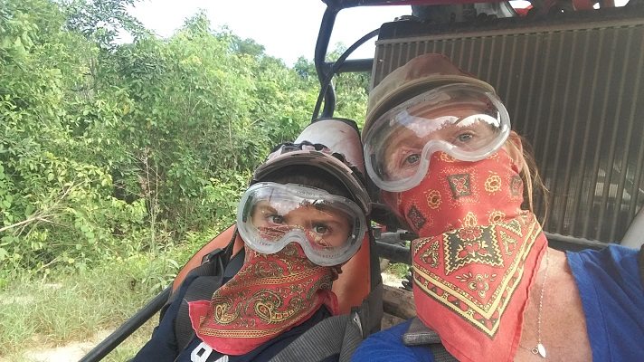 Mother and son on dune buggy