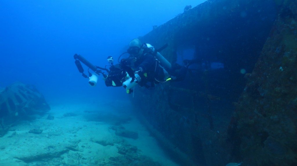 Blue Core diver investigating eagle rays at a shipwreck off the coast of Puerto Morelos