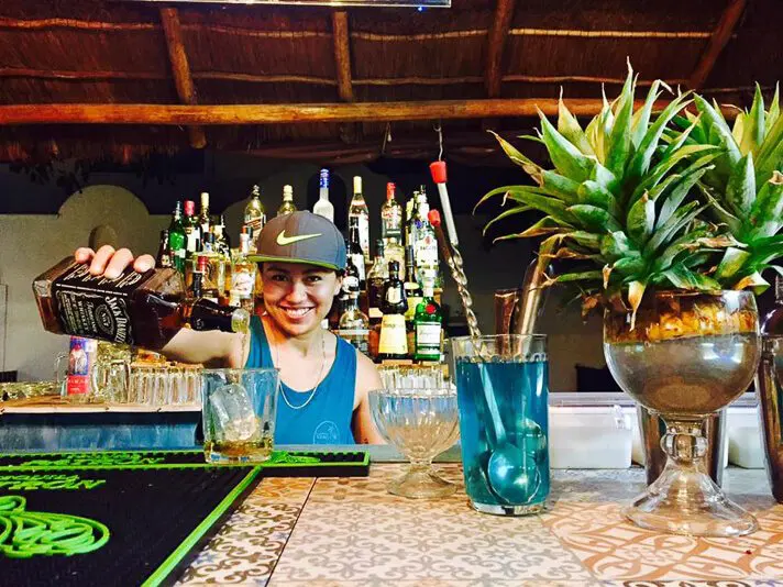 Bartender at bar at El Curandero seafood in Playa del Carmen