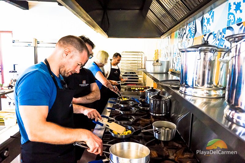 Students prepare meal at El Pueblito Cooking School