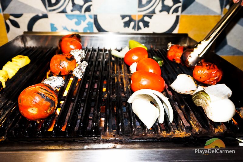 Grilling vegetables at El Pueblito Cooking School at Mayakoba