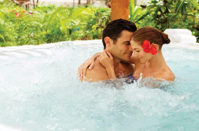 A couple enjoying spa treatments at Excellence Riviera Cancun