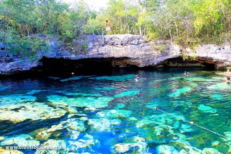 People swimming in blue water