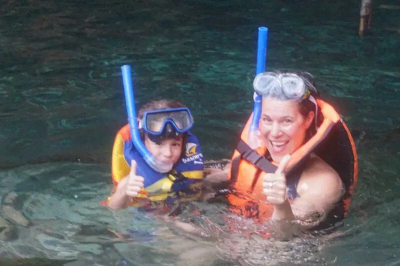 A mother and daugher snorkel at Gran Cenotenear Tulum