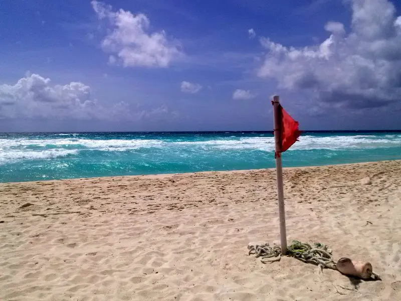 Great Parnassus beach with red flag