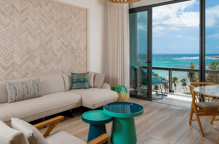 sitting area in a suite at Hilton Tulum with views of the Caribbean Sea 