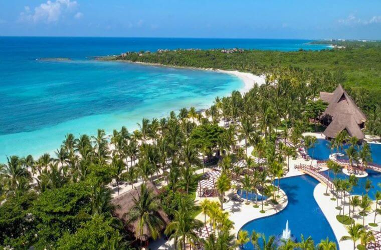 the beach and pool area at Barcelo Maya Grand 