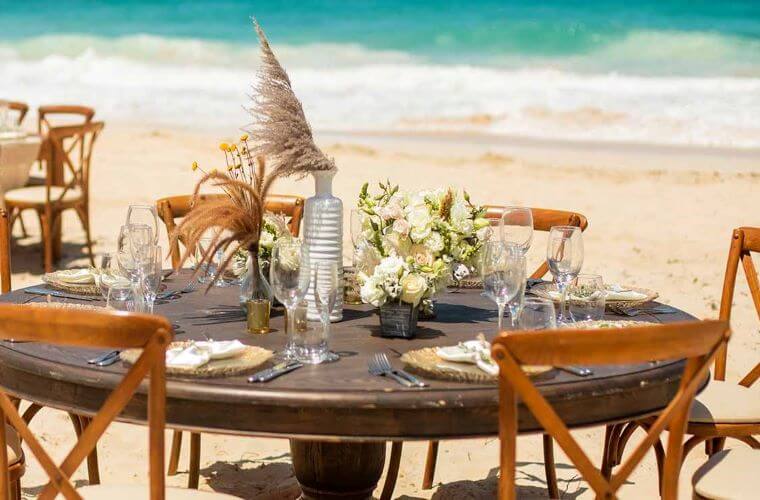 a table set for a beach wedding reception 