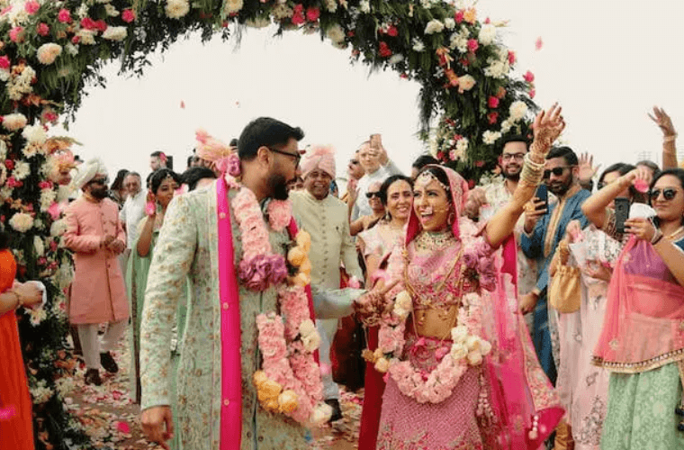 an Indian wedding couple with their guests at their wedding