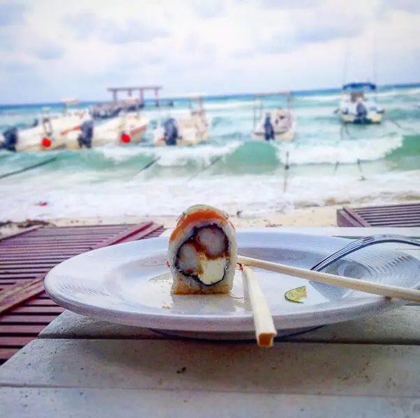 Peace of sushi on plate at indigo beach club