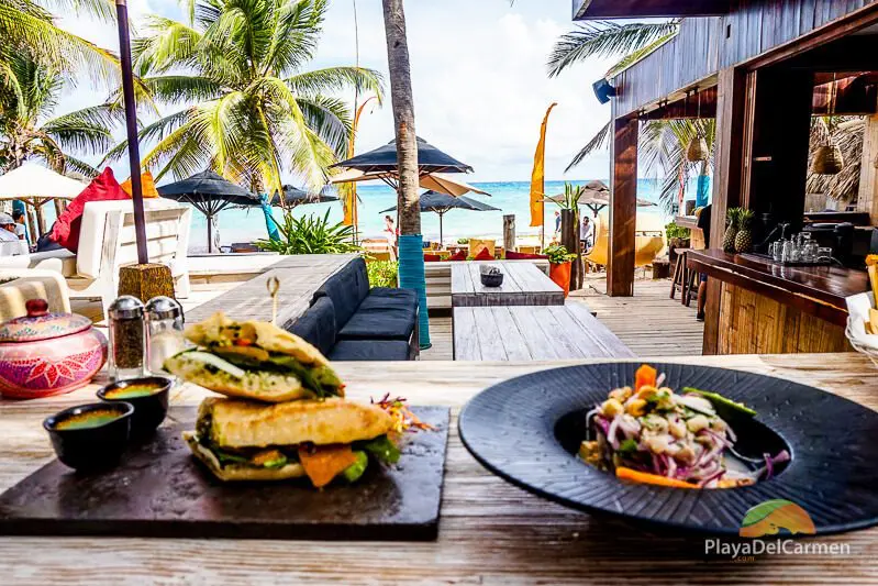 a Mediterranean-style baguette and a fresh ceviche at inti beach club 