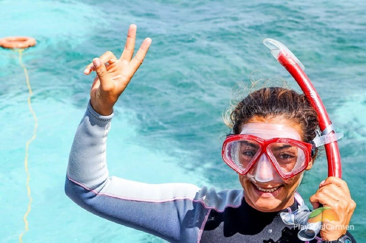 Girl about to go snorkeling in Playa del Carmen