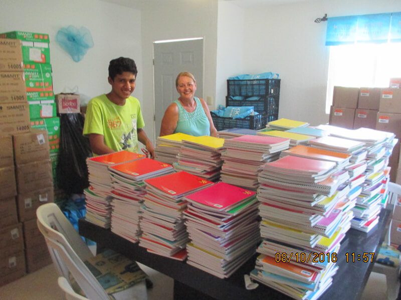 People from the K.K.I.S. project preparing school supplies for kids