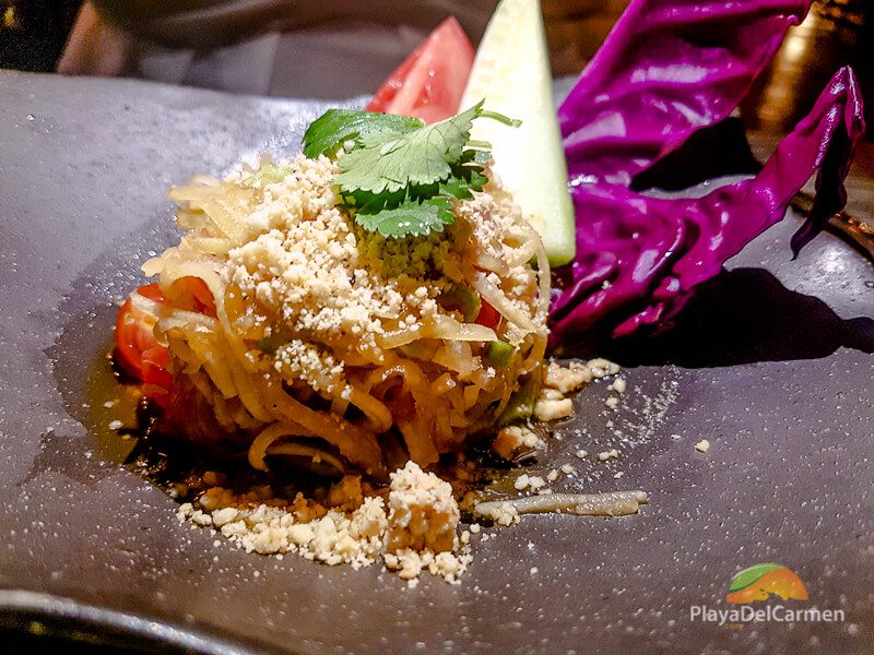 a spicy green papaya salad served with dry shrimp at koh thai restaurant