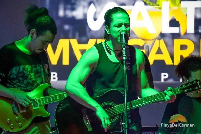 A rock singer performs live music at La Culpa Playa del Carmen