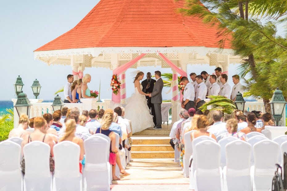 Wedding ceremony taking place under a gazebo in Cancun