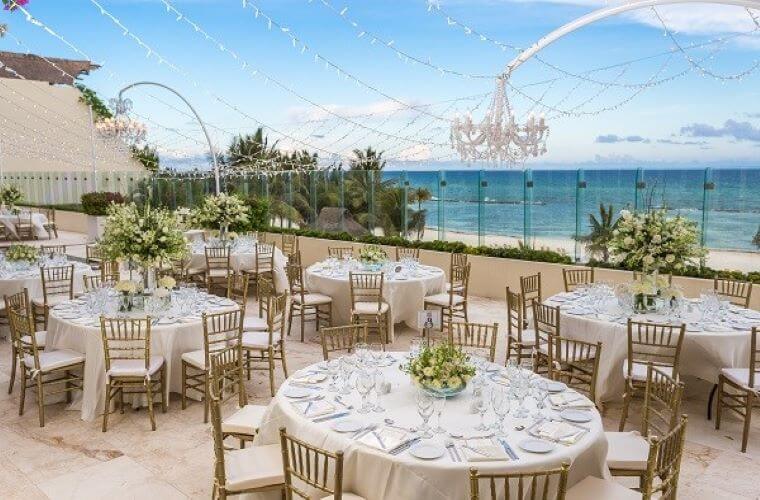 round tables set for an event on the Ocean Terrace