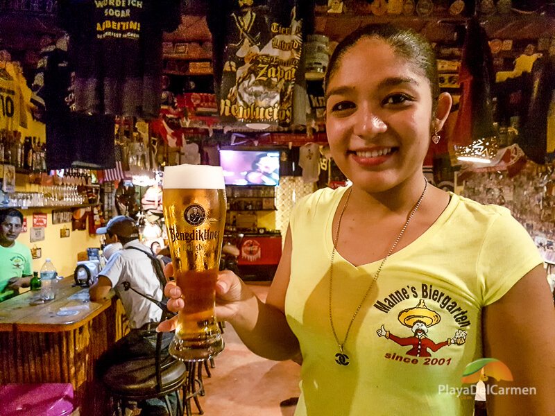 Girl holding beer at Manne's Biergarten