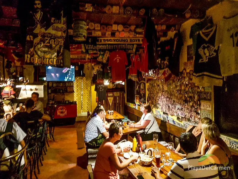 People dinning inside Manne's Biergarten