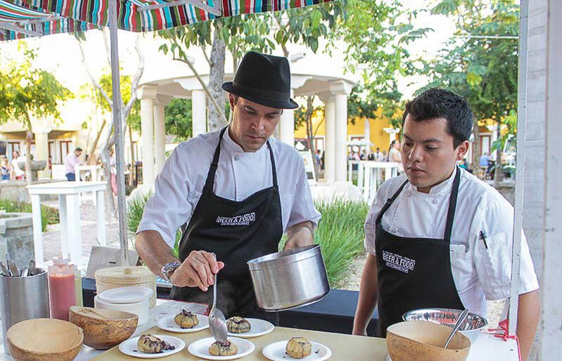 People serving food at Mayakoba Beer & Street Food Fest