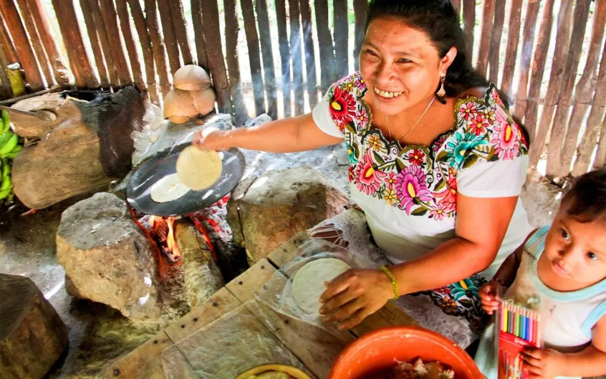 mayan woman sitting with daughter