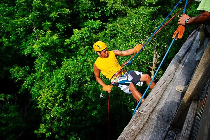 A man rappels down into a sinkhole in Mexico's Riviera Maya